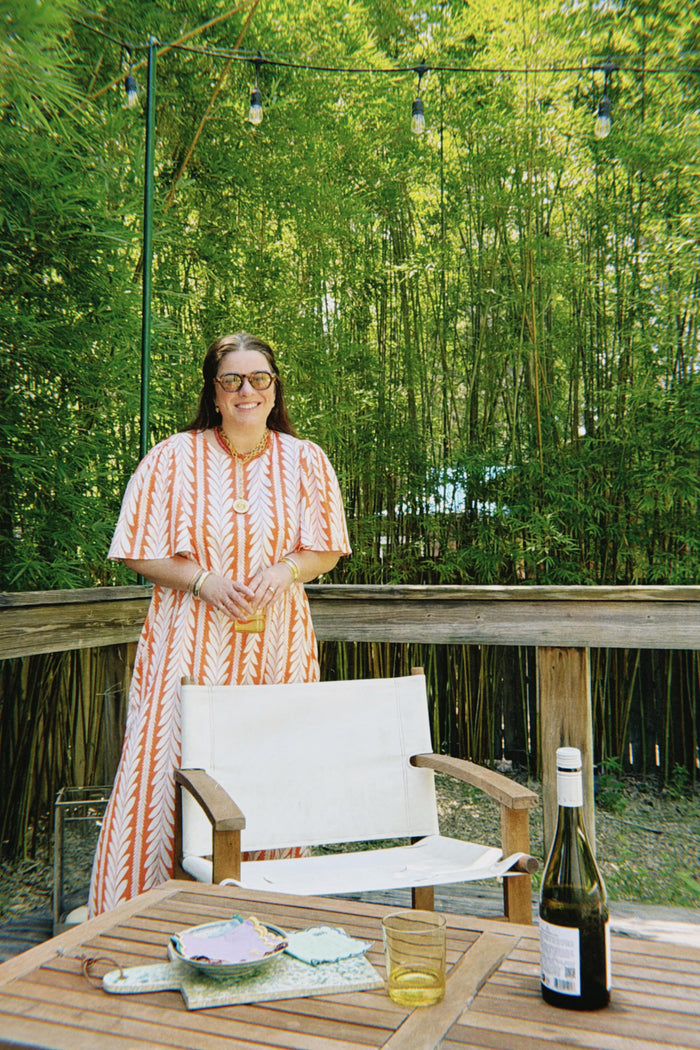 Mary Veronica Mullen in our georgia dress in frond orange
